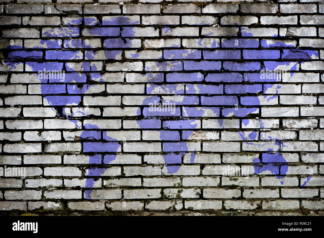 purple world map on a brick background Stock Photo
