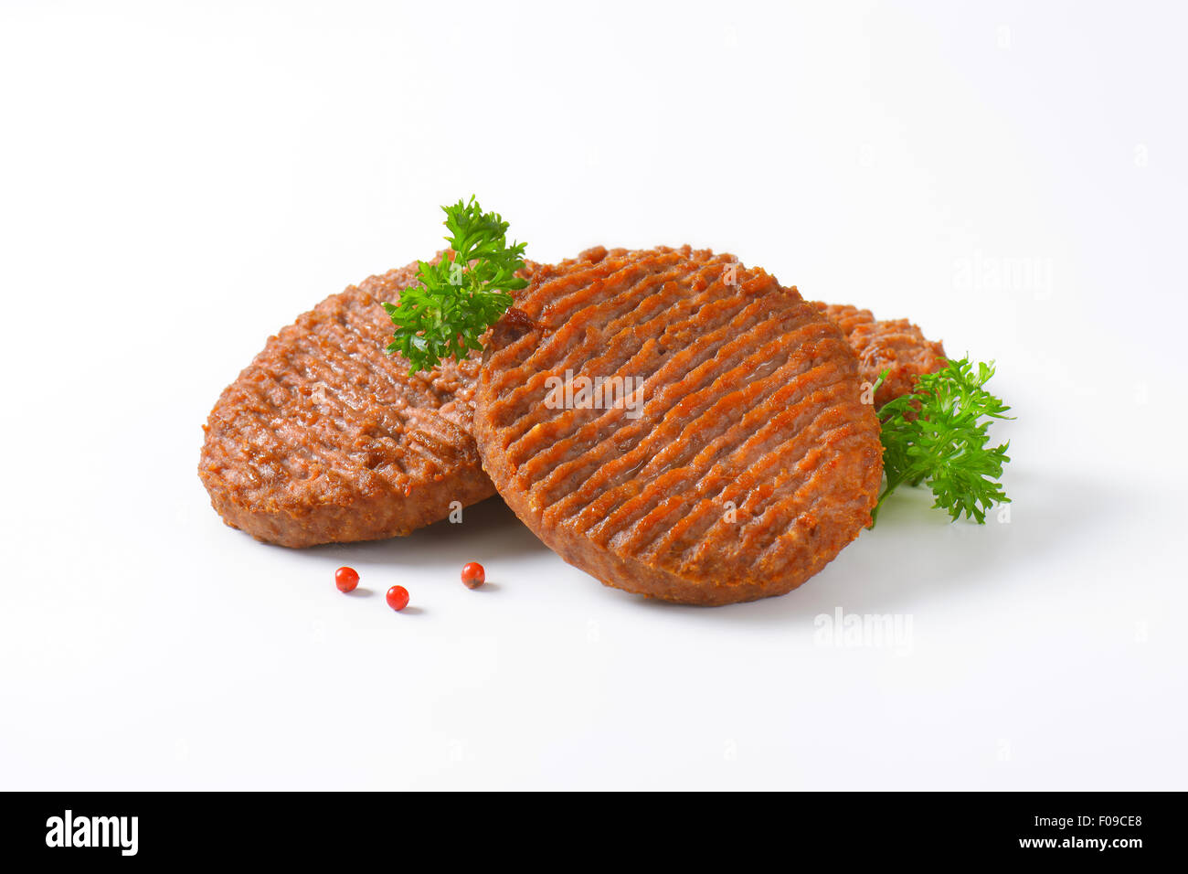 Three Grilled Beef Burger Patties Stock Photo Alamy