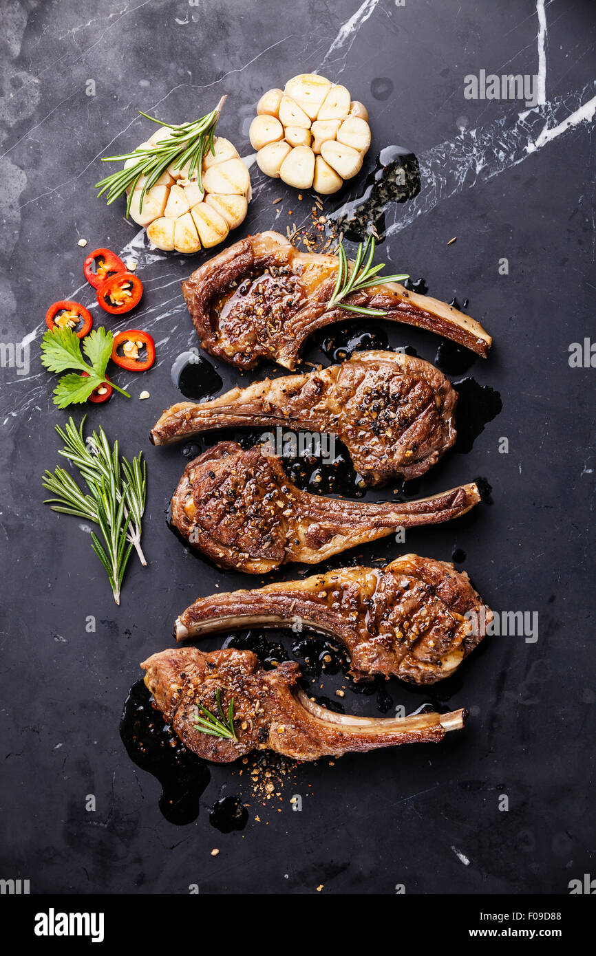 https://c8.alamy.com/comp/F09D88/roasted-lamb-ribs-with-spices-and-garlic-on-black-marble-background-F09D88.jpg