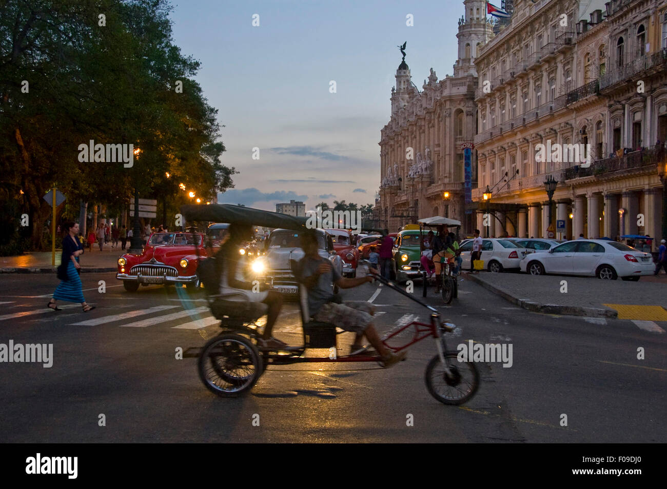Horizontal street view of a bicyclette at dusk in Havana, Cuba. Stock Photo