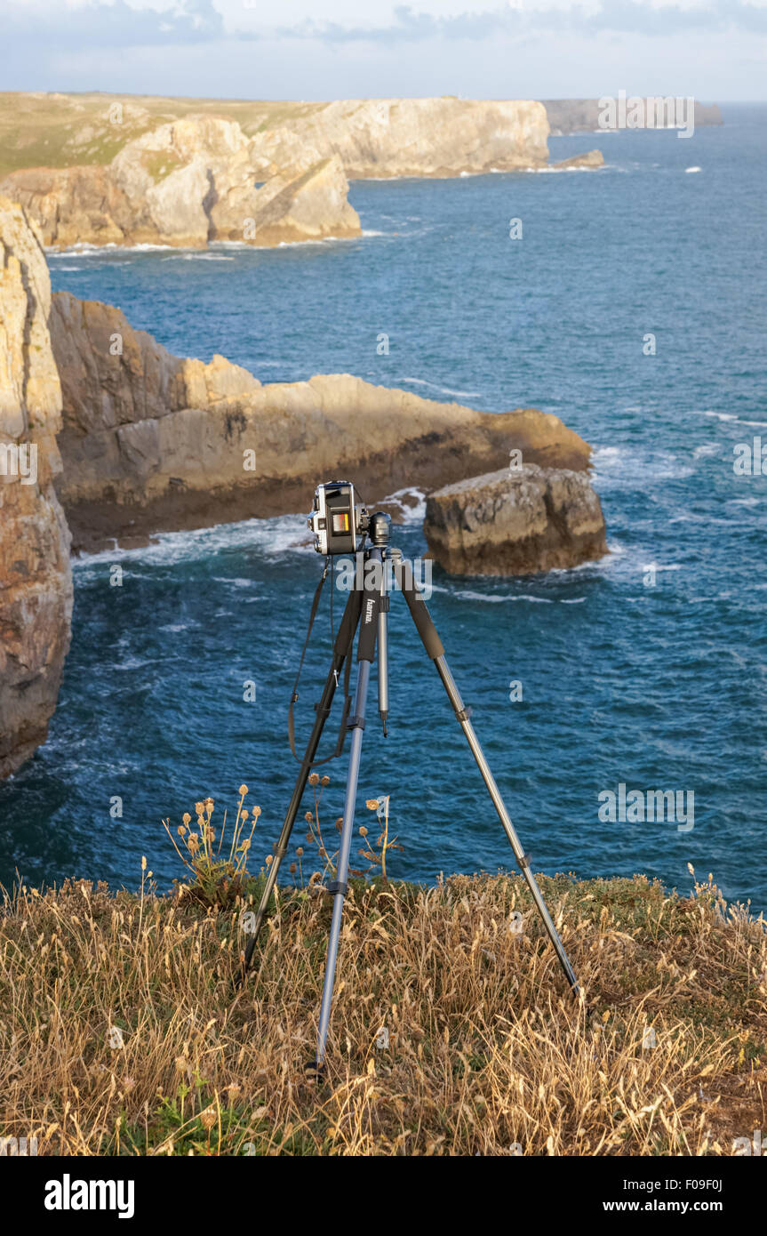 Camera on the tripod on rocky cliffs in Pembrokeshire Coast National Park Wales United Kingdom UK Stock Photo