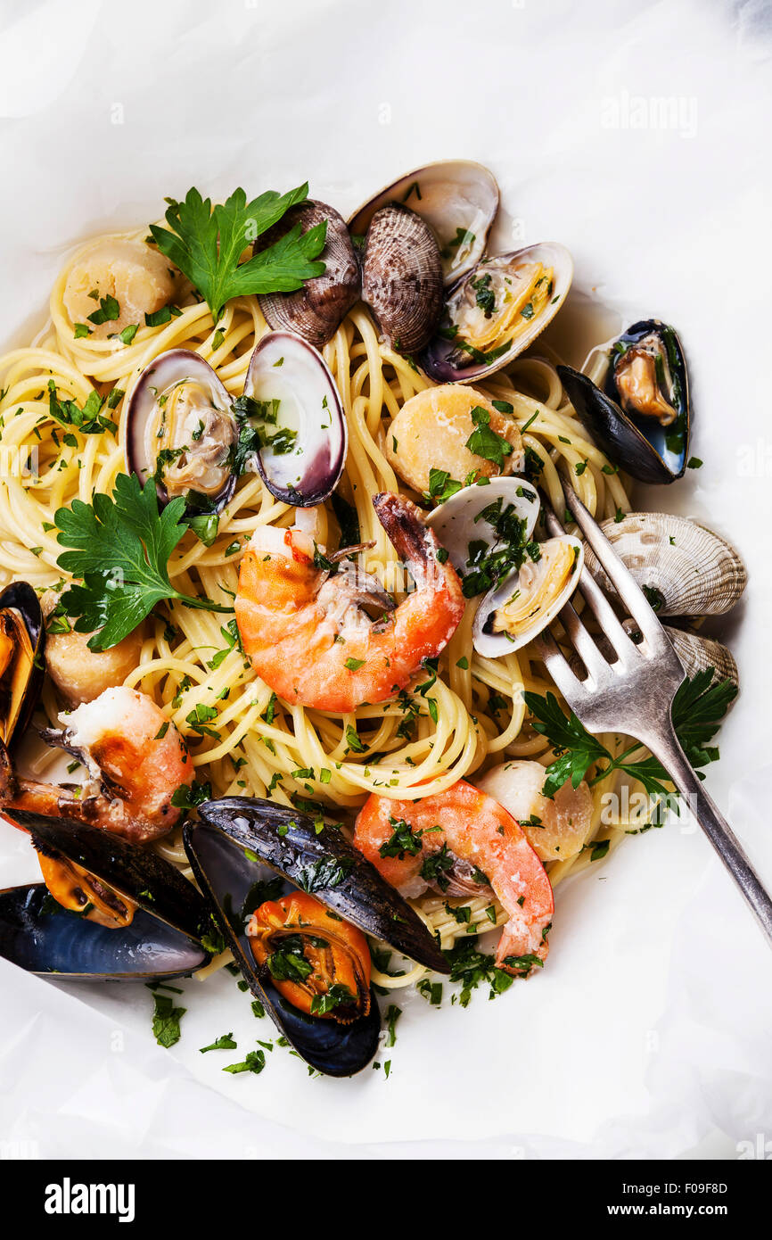 Seafood pasta Spaghetti with clams, prawns, sea scallops on white