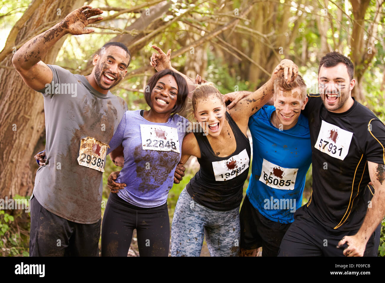 Competitors celebrate completing an endurance sports event Stock Photo