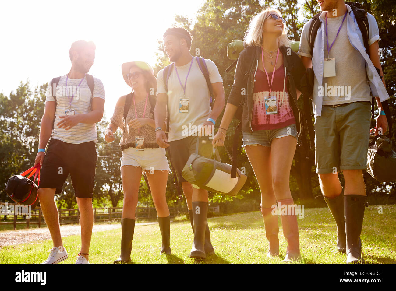 Group Of Young People Going Camping At Music Festival Stock Photo