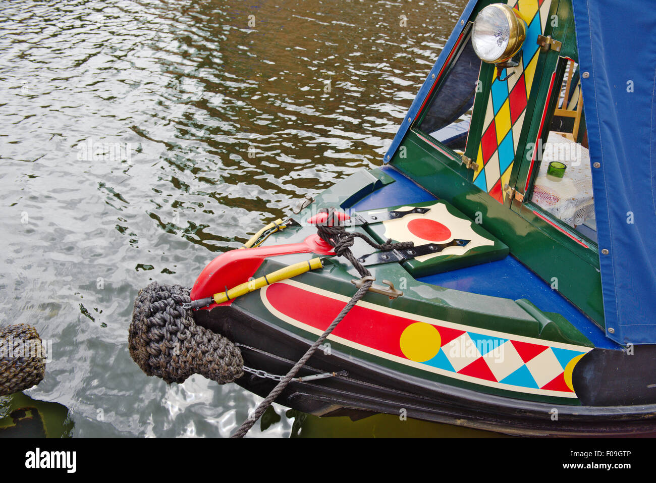 Bow of colourful canal boat on Leeds and Liverpool Canal in centre of city of Leeds, West Yorkshire Stock Photo
