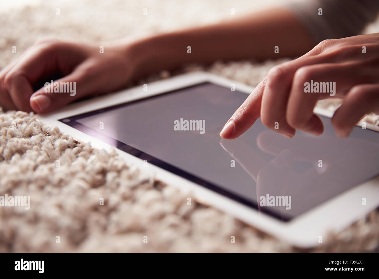 Person Using Tablet Computer Close up of person’s hand using a tablet computer Stock Photo - Alamy