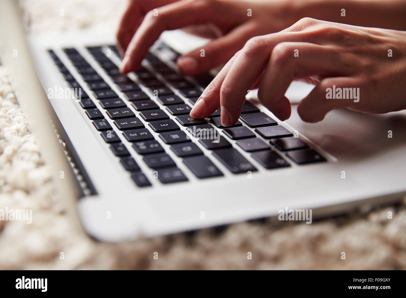 Close up of person’s hands using a laptop computer Stock Photo