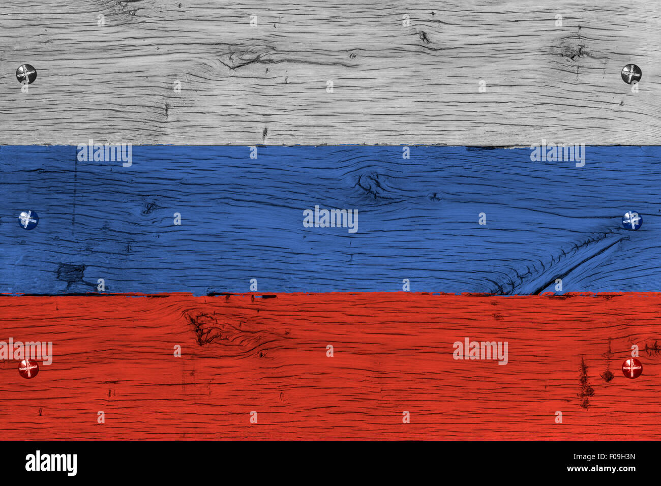 Russia,  Russian Federation national flag. Painting is colorful on wood of old train carriage. Fastened by screws or bolts. Stock Photo