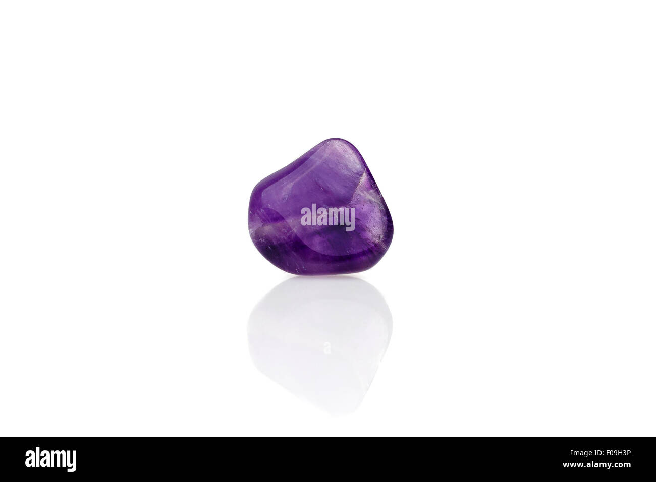 Beautiful purple/violet amethyst back light isolated on white. Stock Photo