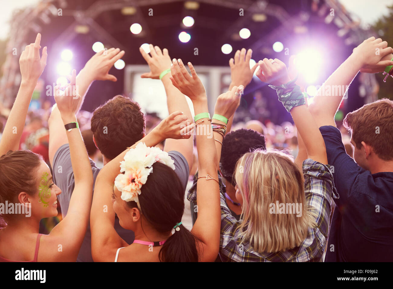 Audience with hands in the air at a music festival Stock Photo