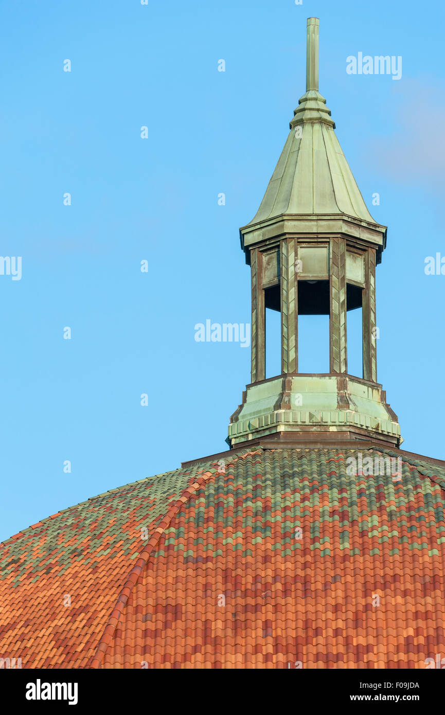 The copper cupola and tiled roof of the historic 1920s First Baptist Church building in downtown Asheville, North Carolina. Stock Photo