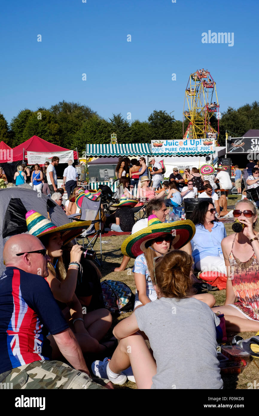 people relaxing at the chilli fiesta festival at west dean gardens near