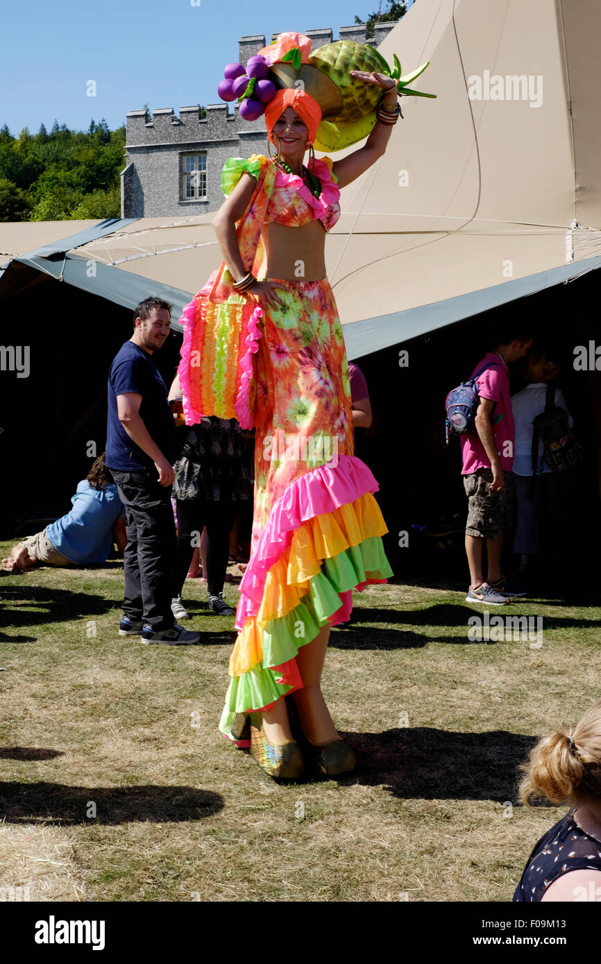 female on stilts at the chilli fiesta festival at west dean gardens