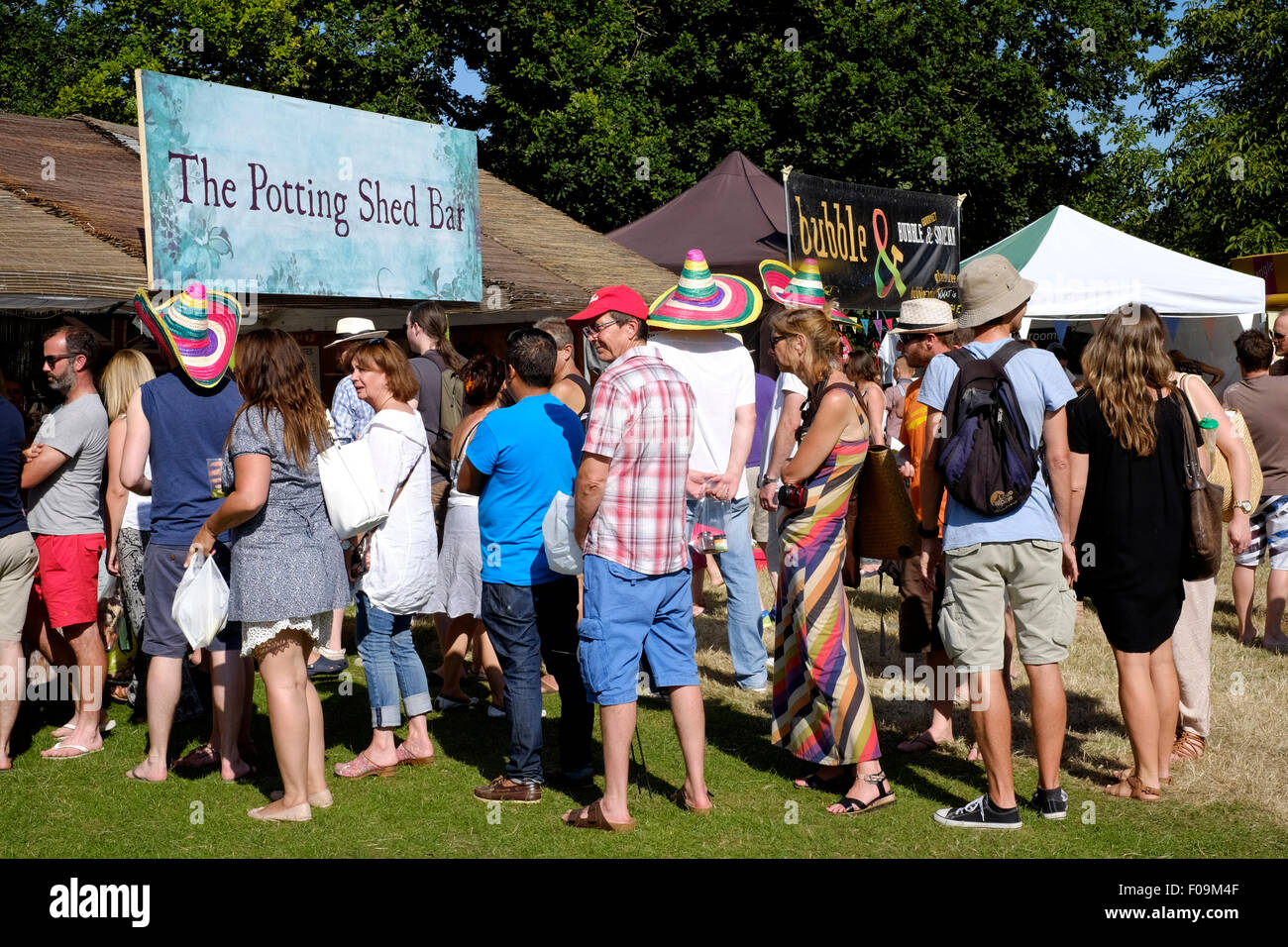 visitors queue at a bar at the chilli fiesta festival at west dean gardens near chichester west