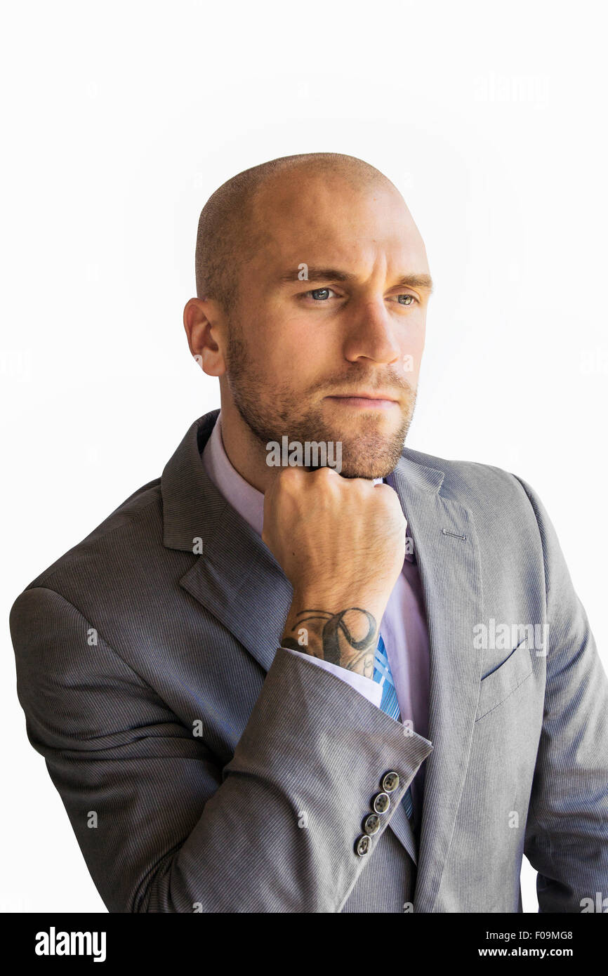 Man in business suit pondering Stock Photo