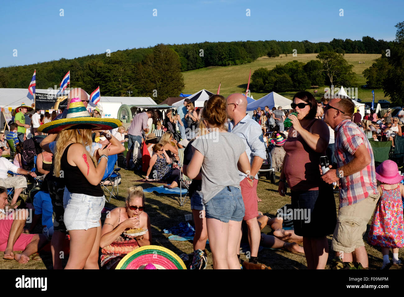 crowds enjoying themselves at the chilli fiesta festival at west dean gardens near chichester
