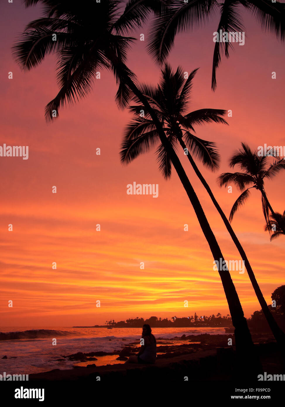 A spectacular, orange sunset over Kailua Bay in Kailua-Kona, Big Island, Hawai'i (Hawaii). Stock Photo