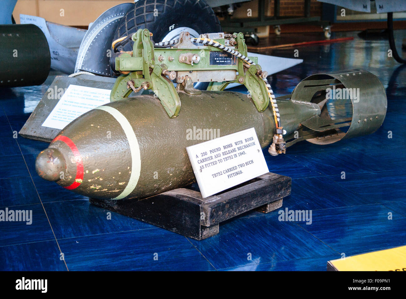 World war two British 250 lb bomb on display in the Spitfire memorial museum at Manston. Red band around nose of bomb. Stock Photo