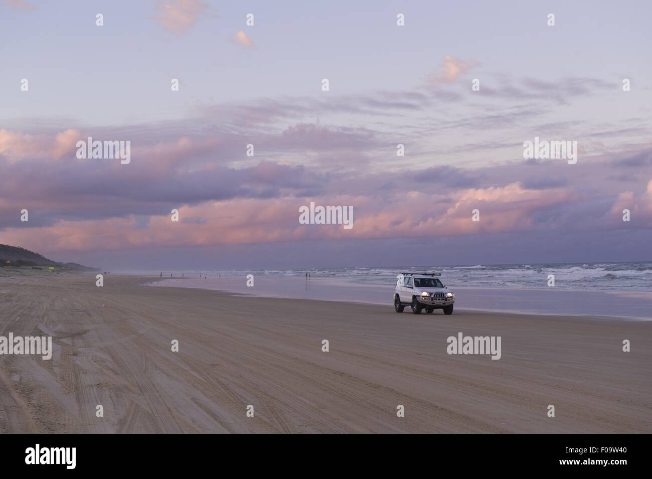 View of sunset with sky, clouds and car, Fraser Island, Queensland, Australia Stock Photo