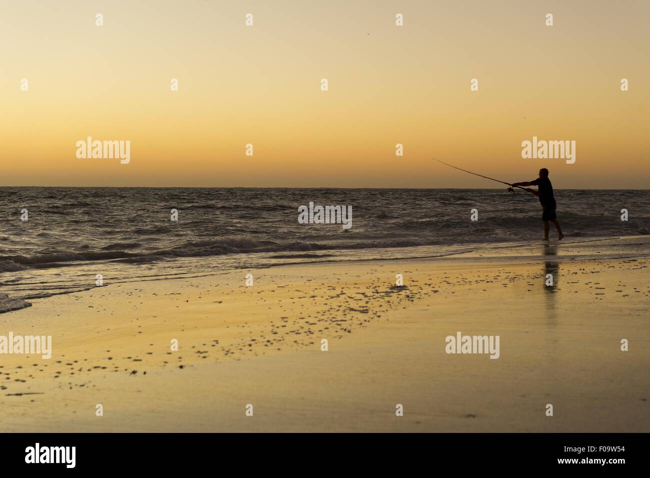 Man fishing in sea at Kalbarri National Park, Cervantes, Australia Stock Photo