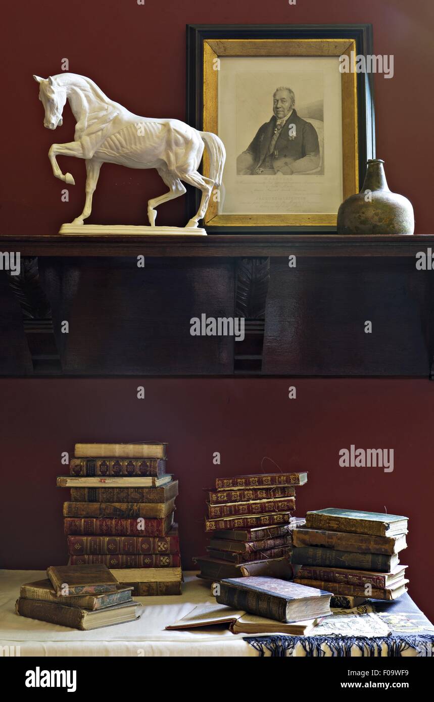 Books, horse sculpture and photo frame in Atelier at Leighton House Museum, London, UK Stock Photo