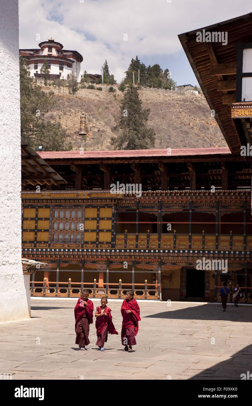 Children walking in Paro Dzong courtyard in Bhutan Stock Photo