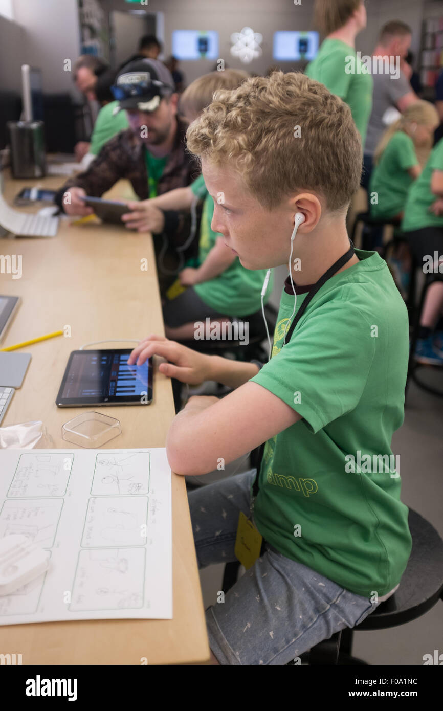 Kids at an Apple Summer camp video workshop at the Apple Store in Solihull, England Stock Photo