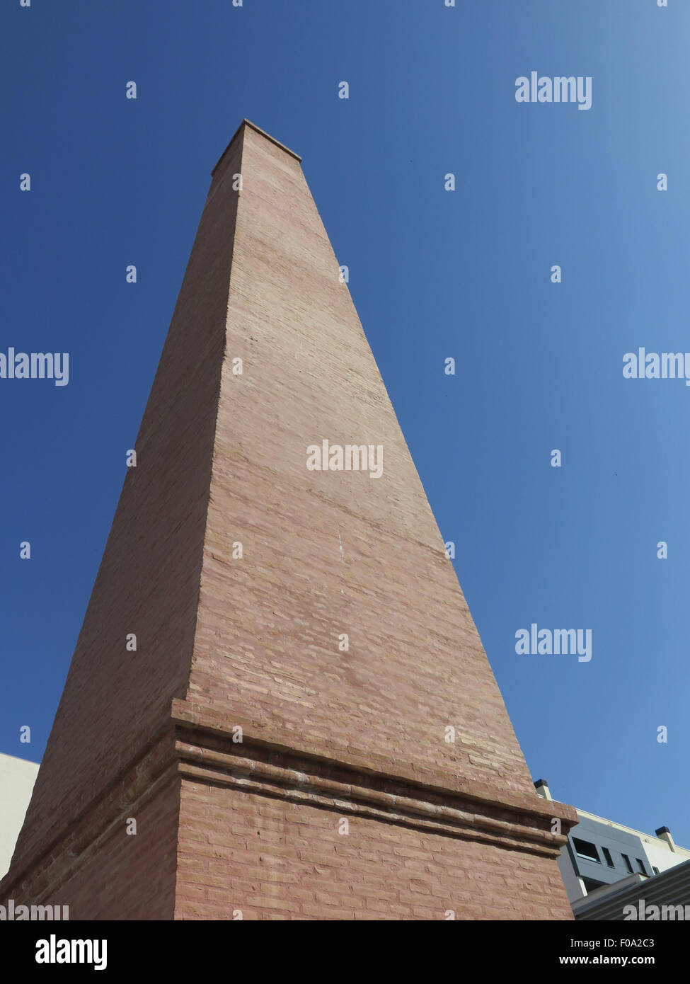 Tall brick built chimney in Malaga Town Centre, Andalucia Stock Photo