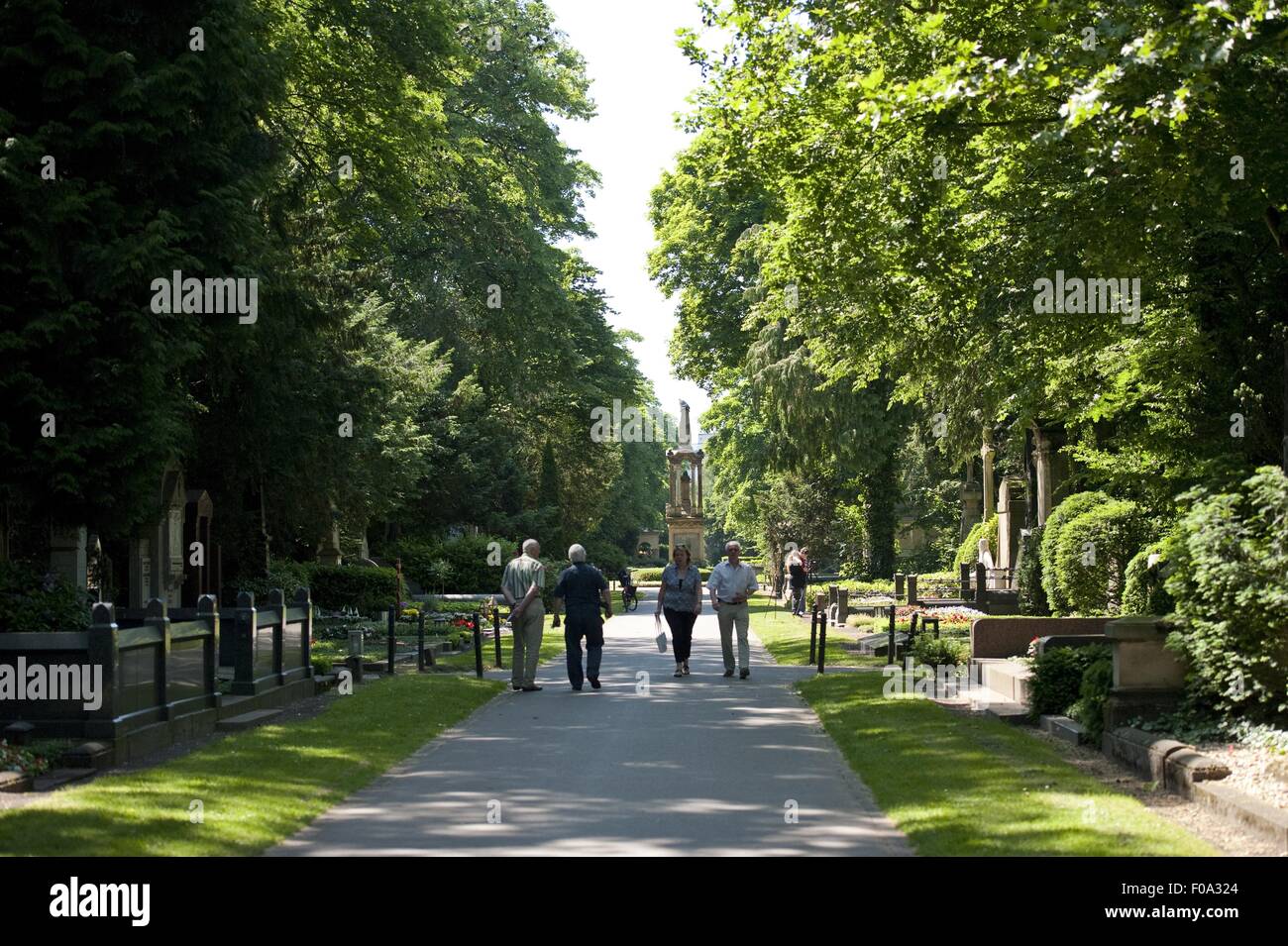 People walking on street at Melaten Riedhof, Lindenthal, Cologne, Germany Stock Photo