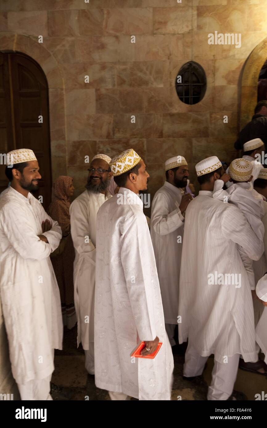 Pilgrims dressed traditionally at Holy Sepulchre in Calvary Chapel, Jerusalem, Israel Stock Photo