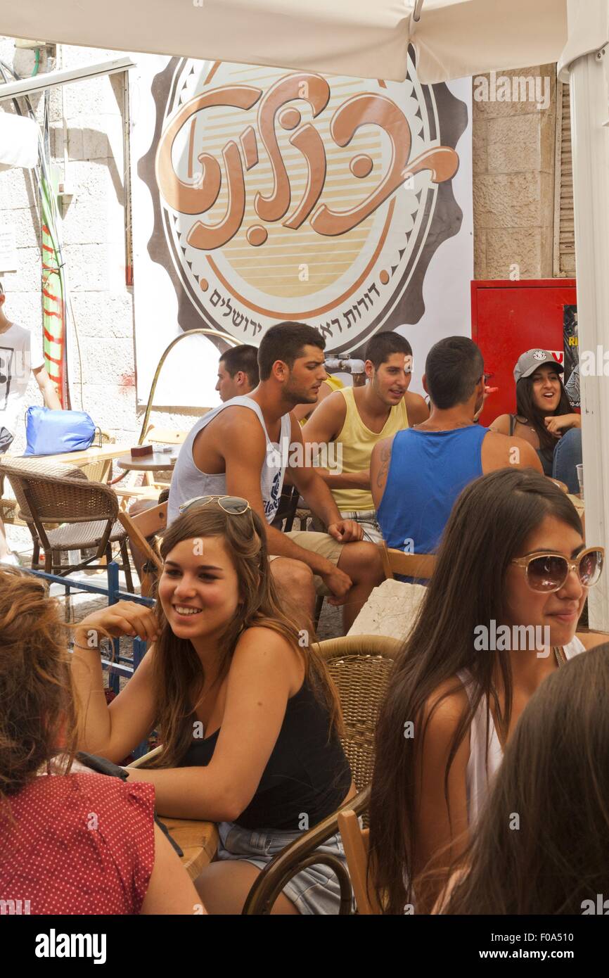 People sitting outside cafe on Jaffa Street, Jerusalem, Israel Stock Photo