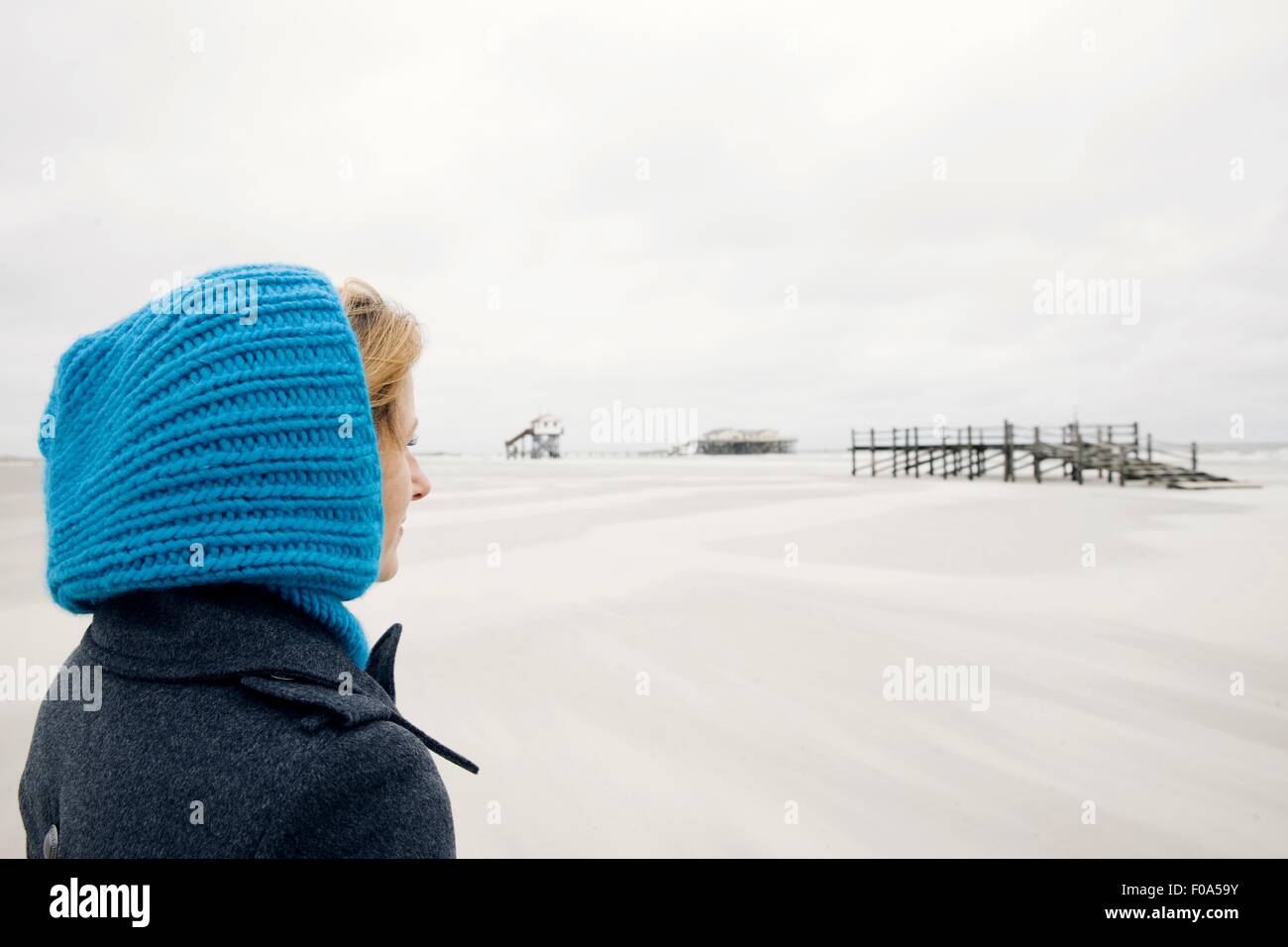 Woman wearing hood windy beach hi-res stock photography and images - Alamy