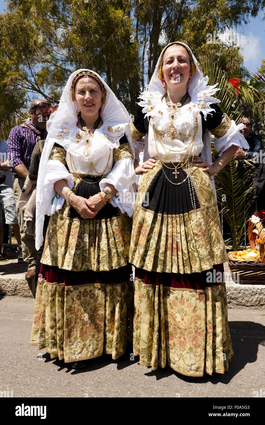 Two women in national costume on the country road hi res stock