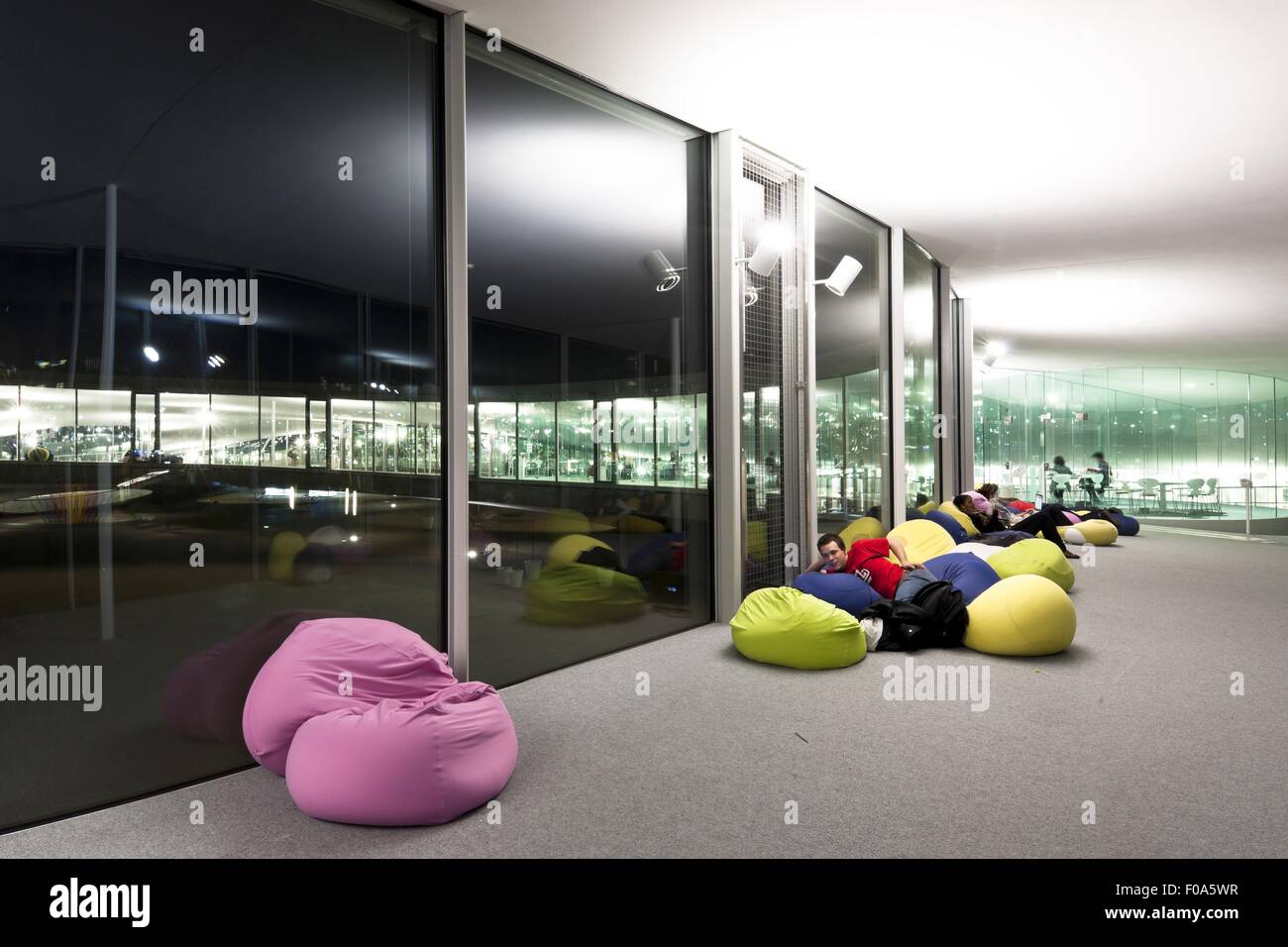 Students relaxing on bean bag at Laussanne, Switzerland Stock Photo - Alamy