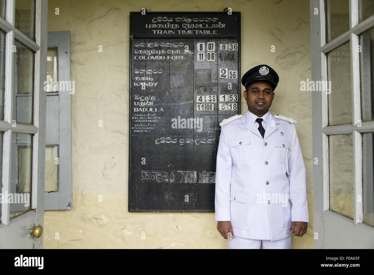 Portrait of stationmaster in Idalgashinna village, smiling, Sri Lanka