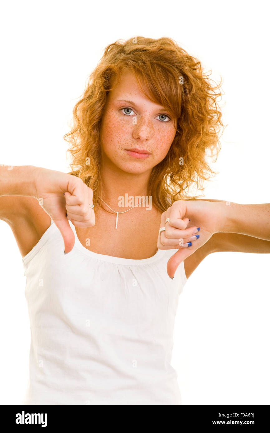 Young redhaired woman holding both thumbs down Stock Photo