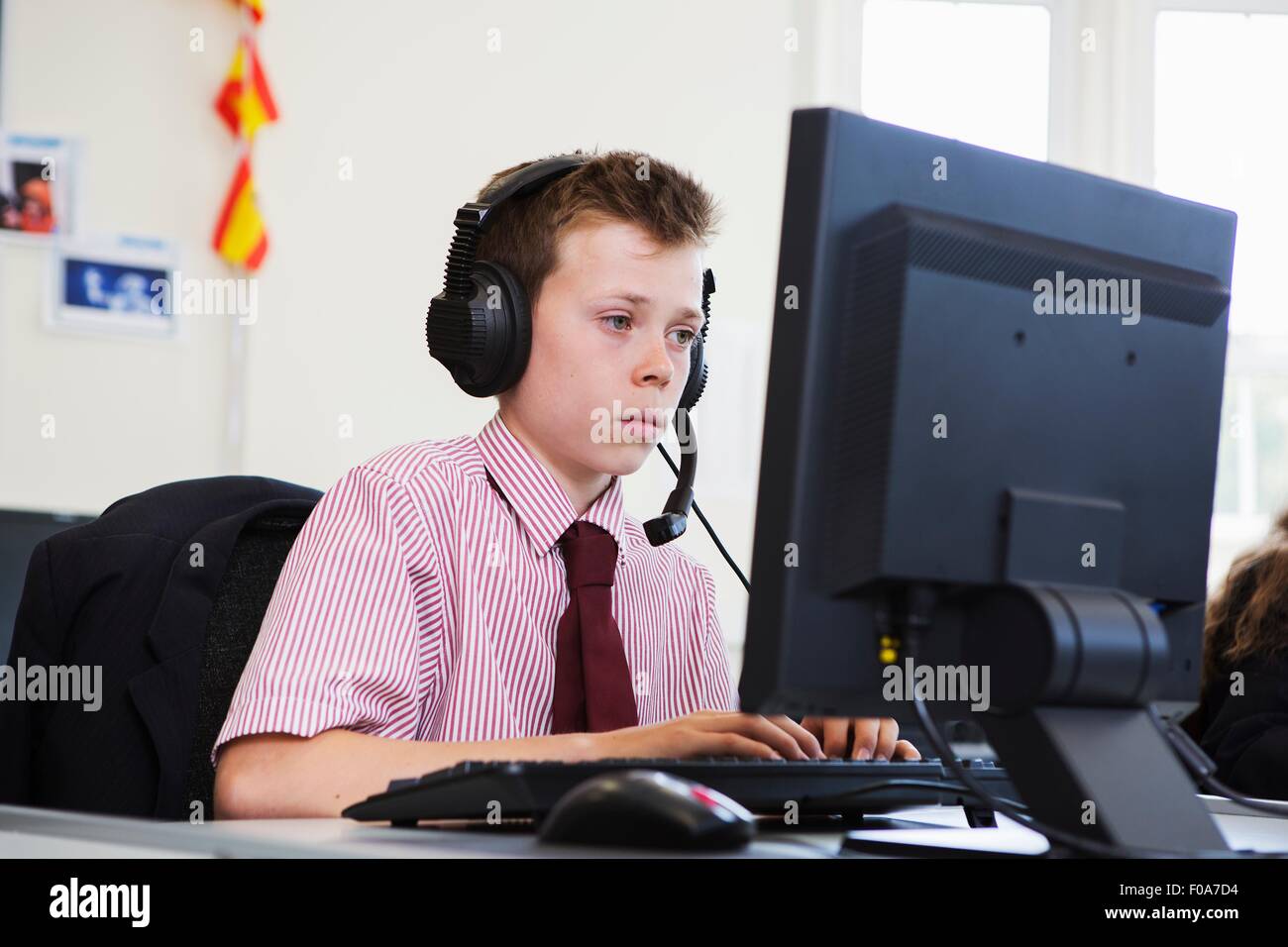 Student using computer in classroom Stock Photo - Alamy