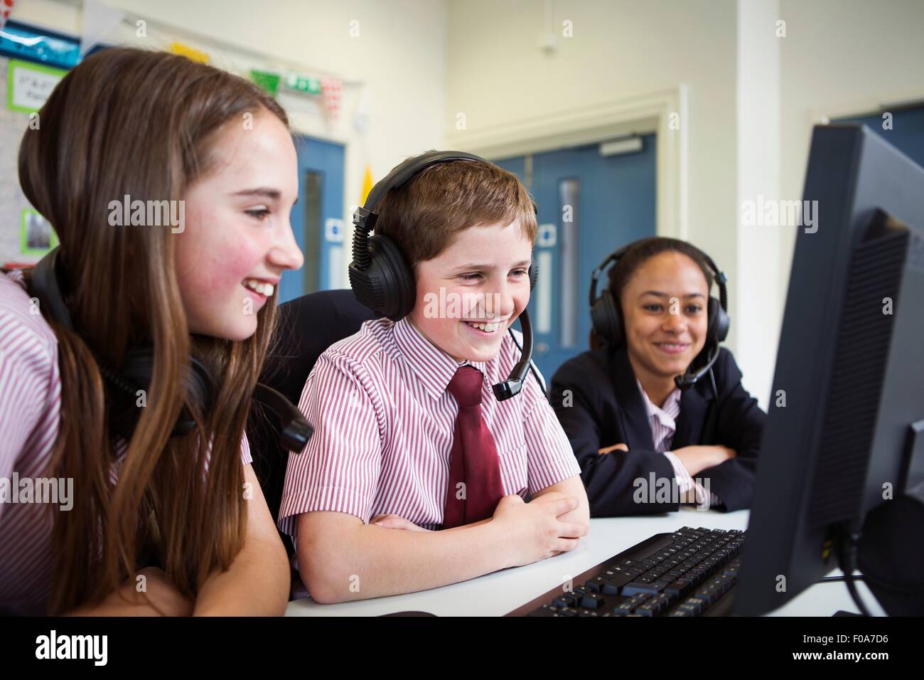 Students using computer in classroom Stock Photo - Alamy