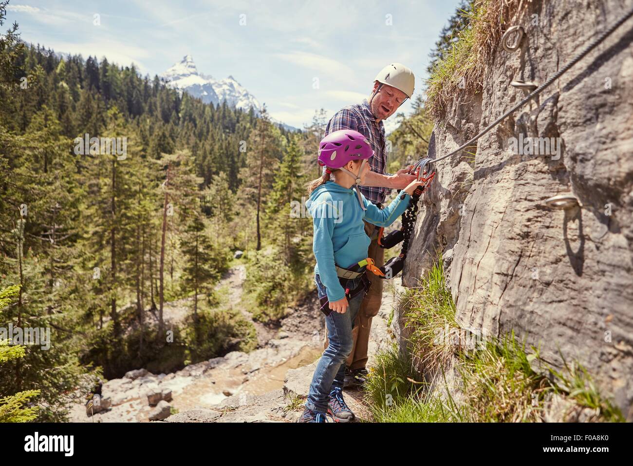 Father and child rock climbing, Ehrwald, Tyrol, Austria Stock Photo
