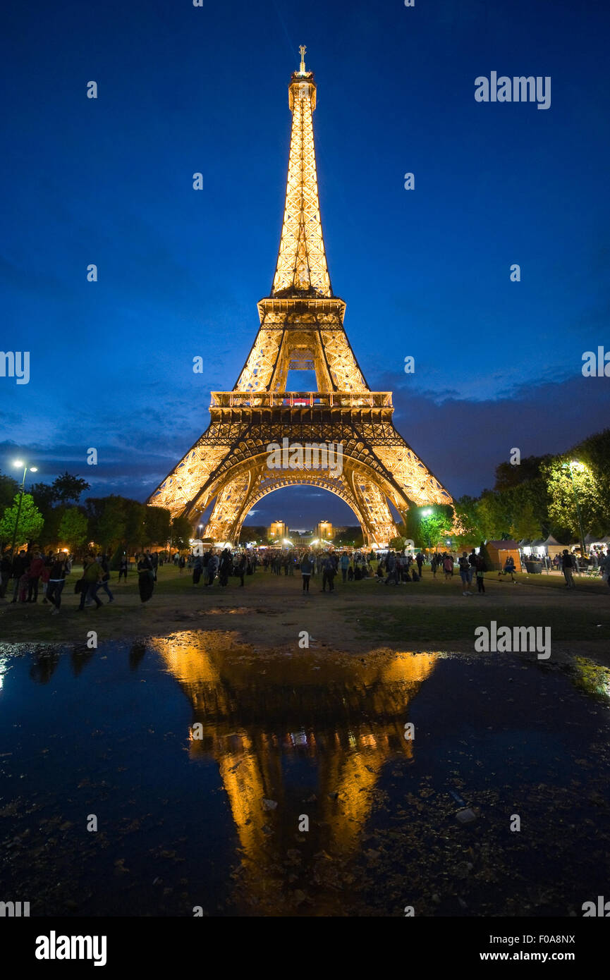 Tourists are visiting the eiffel tower in the twilight in Paris in France Stock Photo