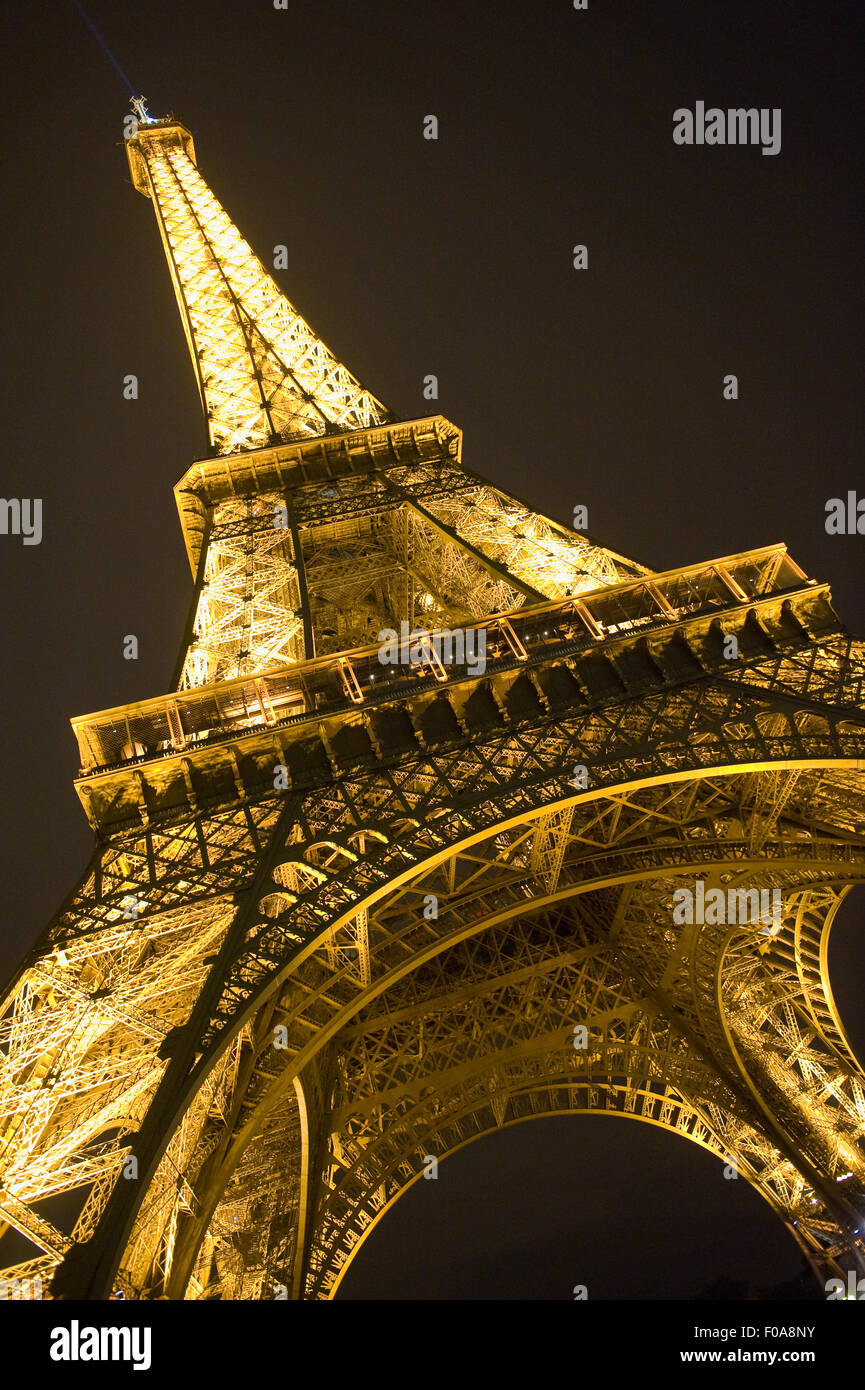 The lights of the Eiffel tower in the night in Paris in France Stock