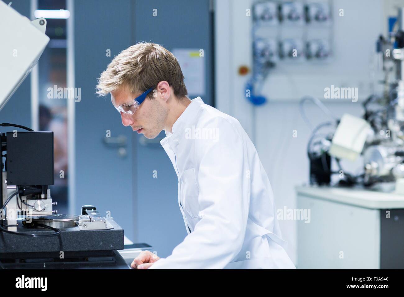 Male scientist monitoring equipment in laboratory Stock Photo