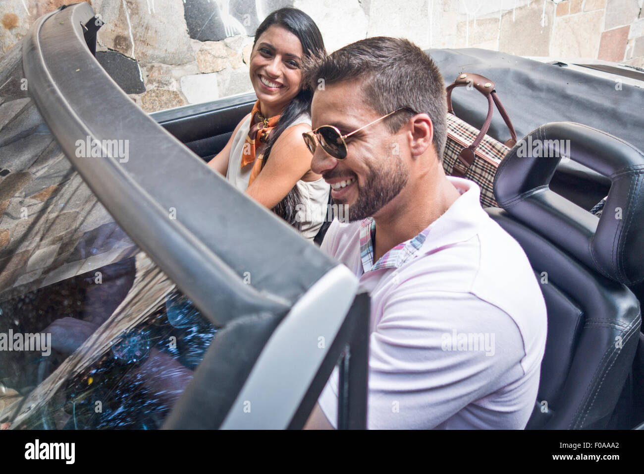 Mid adult couple in convertible car Stock Photo