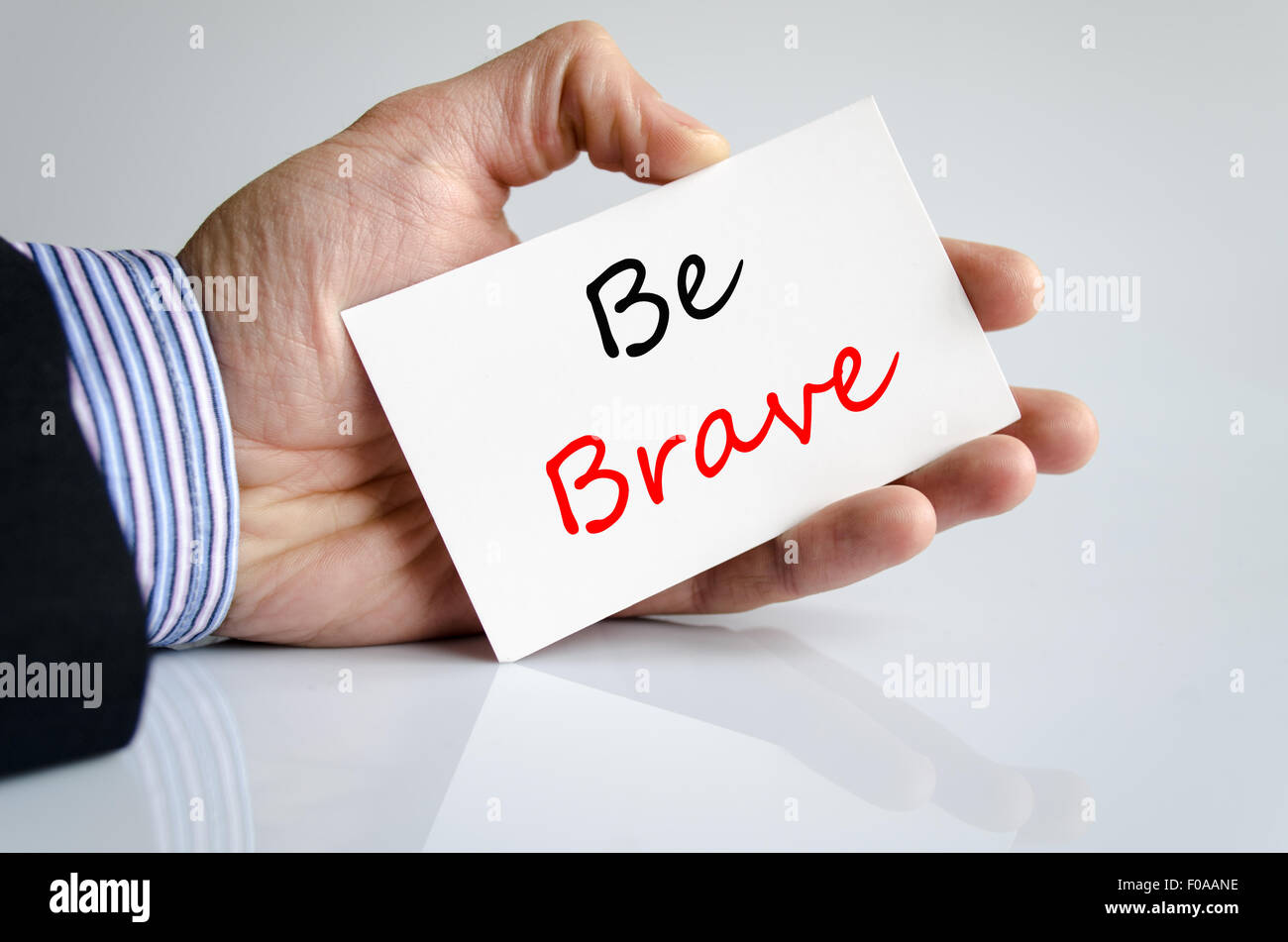 Be brave text concept isolated over white background Stock Photo