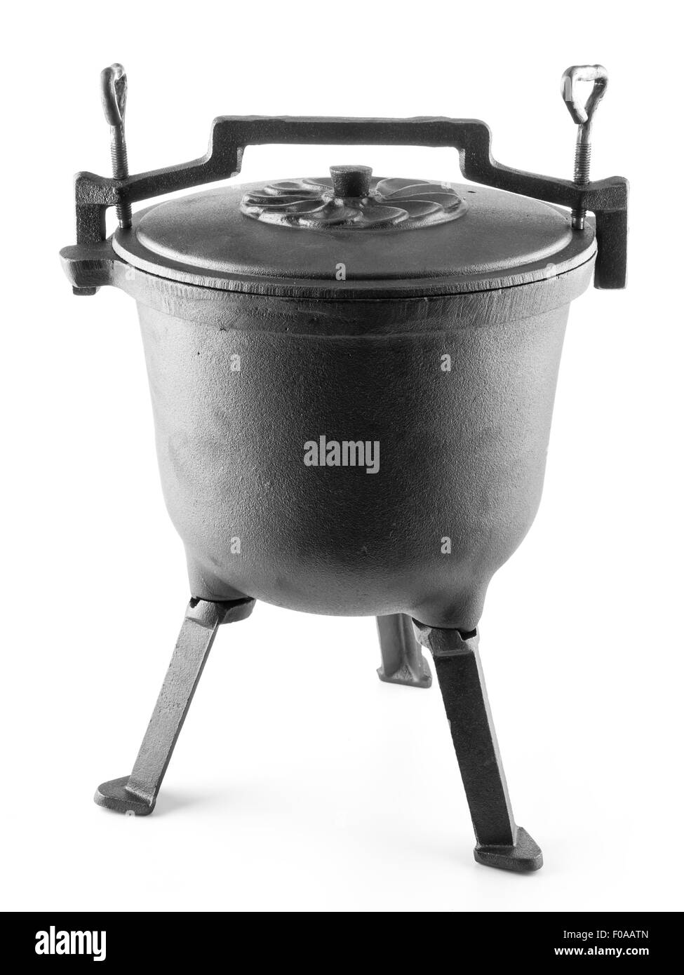 Black cast-iron kettle shot on white background Stock Photo