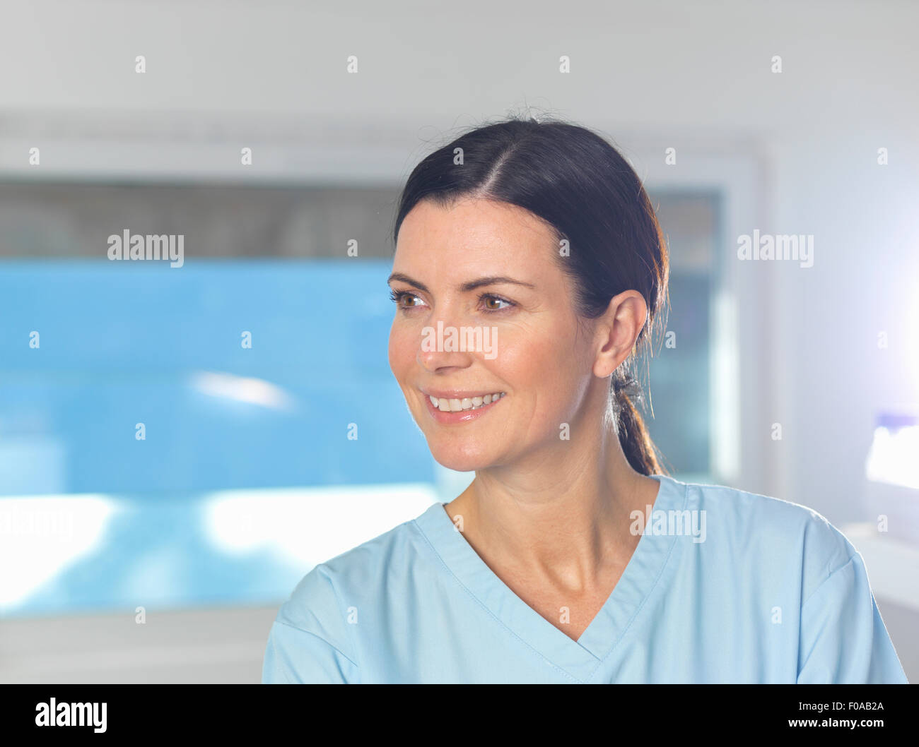 Health worker at work, window in background. Stock Photo