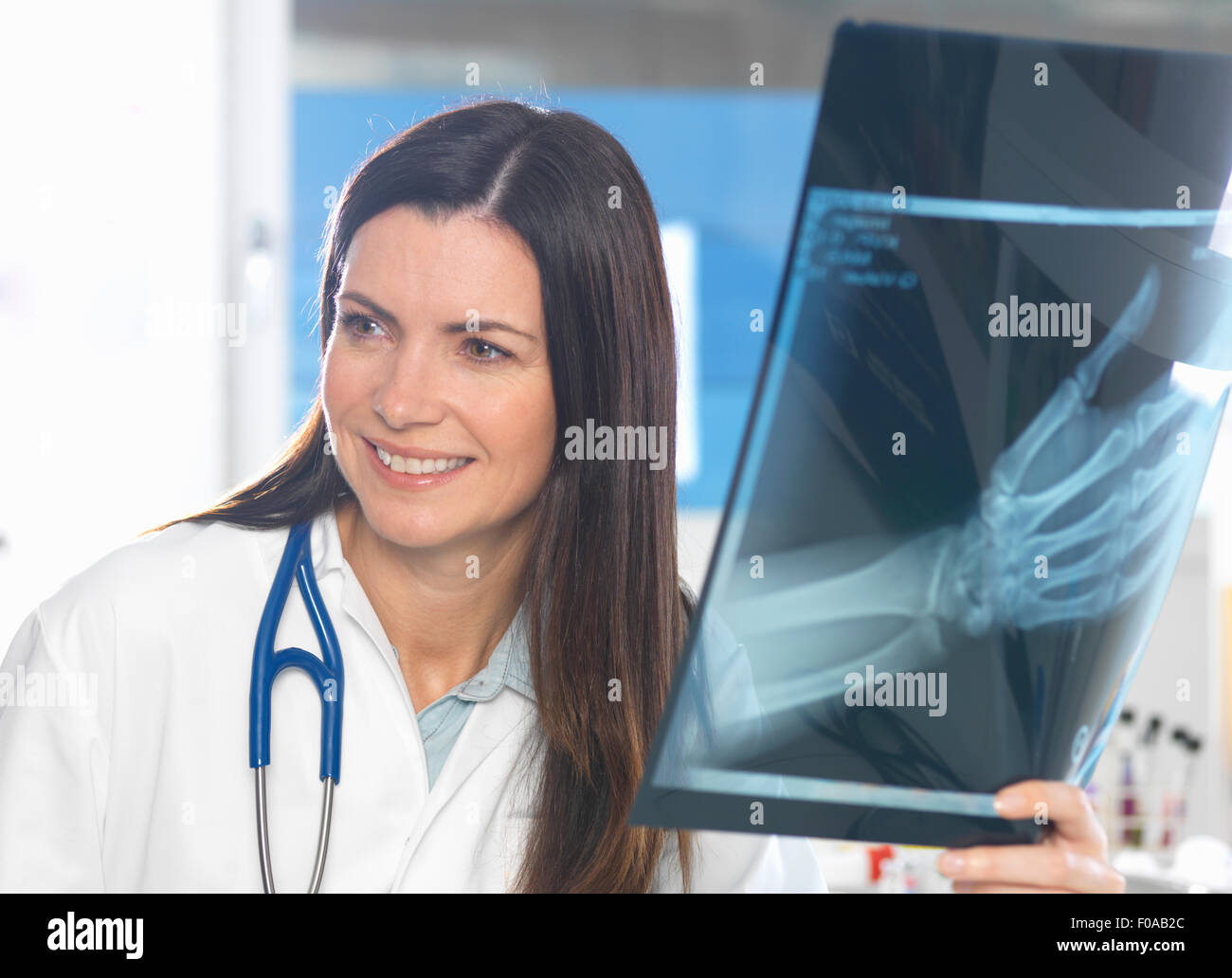 Orthopaedic consultant viewing x-ray of hand Stock Photo