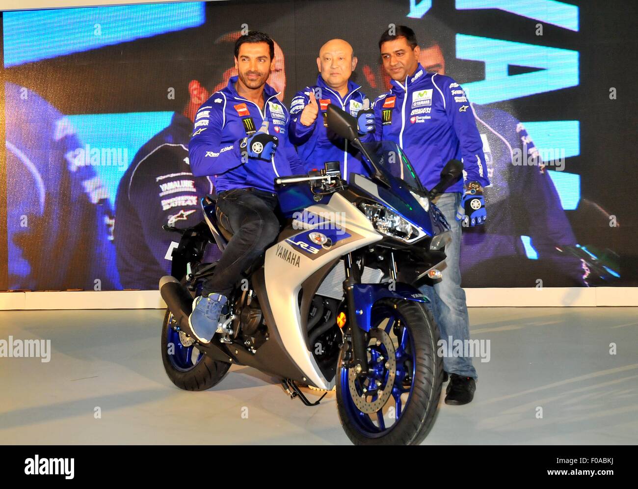Uttar Pradesh, India. 11th Aug, 2015. Bollywood Acotro johan Ebraiam, Mr. Masaki Asano, Managing Director, Yamaha Motor India Sales Pvt. Ltd and Mr. Roy Kurian, Vice President- Sales & Marketing, Yamaha Motor India Sales Pvt. Ltd today, launched yet another exciting offering – the YZF-R3 sports model. The grand India launch took place at the most suited racer's paradise, The Budhha International Circuit. The YZF – R3 will cost the Indian buyers Rs. 3, 25,000 and will be available at select authorised Yamaha dealerships in two exciting colour schemes - Racing Blue and Black Lightning. © PACIFIC Stock Photo