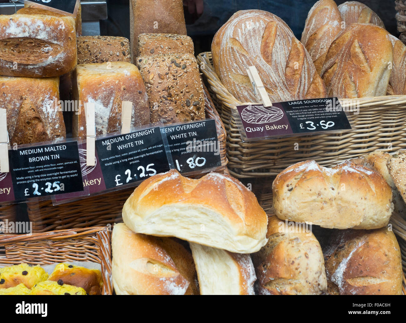 Bread for sale in a bakery shop window in Fowey, Cornwall, England, UK