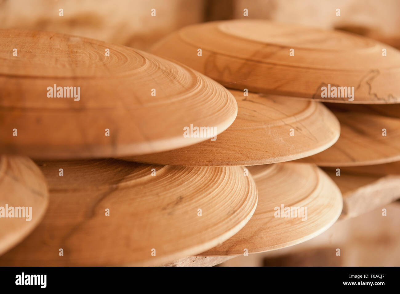 Hand turned wooden plates, close-up Stock Photo